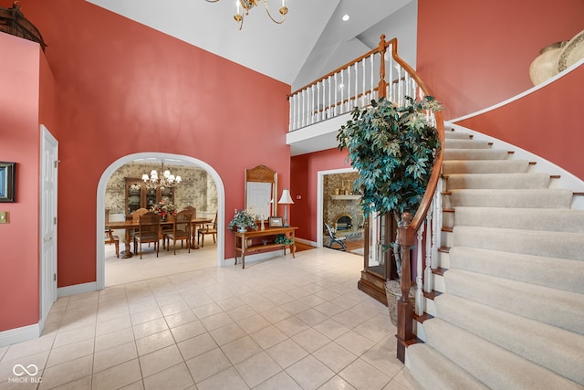 6821 Ripple Creek Dr, Lafayette, IN 47905 - foyer with baseboards, stairs, a chandelier, and high vaulted ceiling