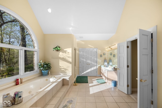 6821 Ripple Creek Dr, Lafayette, IN 47905 - bathroom featuring a whirlpool tub, tile patterned floors, high vaulted ceiling, and vanity