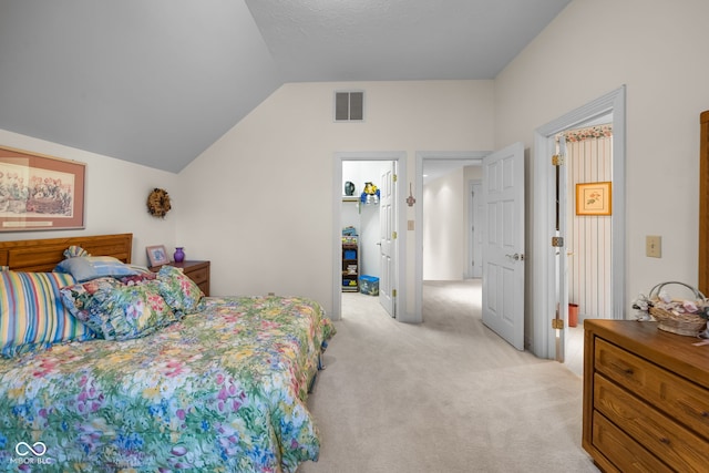 6821 Ripple Creek Dr, Lafayette, IN 47905 - bedroom featuring visible vents, light carpet, and vaulted ceiling