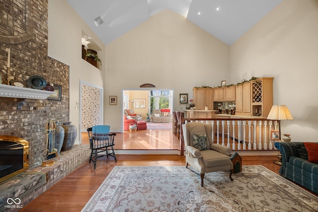 6821 Ripple Creek Dr, Lafayette, IN 47905 - living area featuring a fireplace, wood finished floors, and high vaulted ceiling