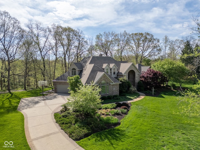 6821 Ripple Creek Dr, Lafayette, IN 47905 - view of property exterior with a yard, an attached garage, and driveway