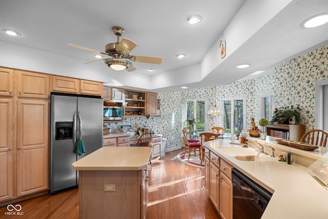 6821 Ripple Creek Dr, Lafayette, IN 47905 - kitchen featuring ceiling fan, wallpapered walls, light wood-type flooring, light countertops, and appliances with stainless steel finishes