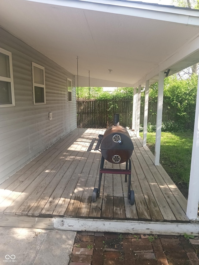wooden deck featuring fence