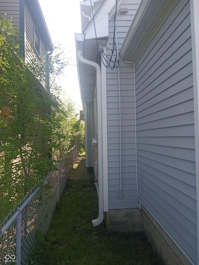 view of home's exterior featuring fence