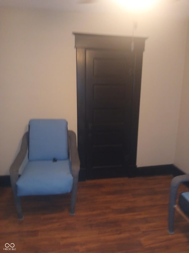 sitting room featuring wood finished floors