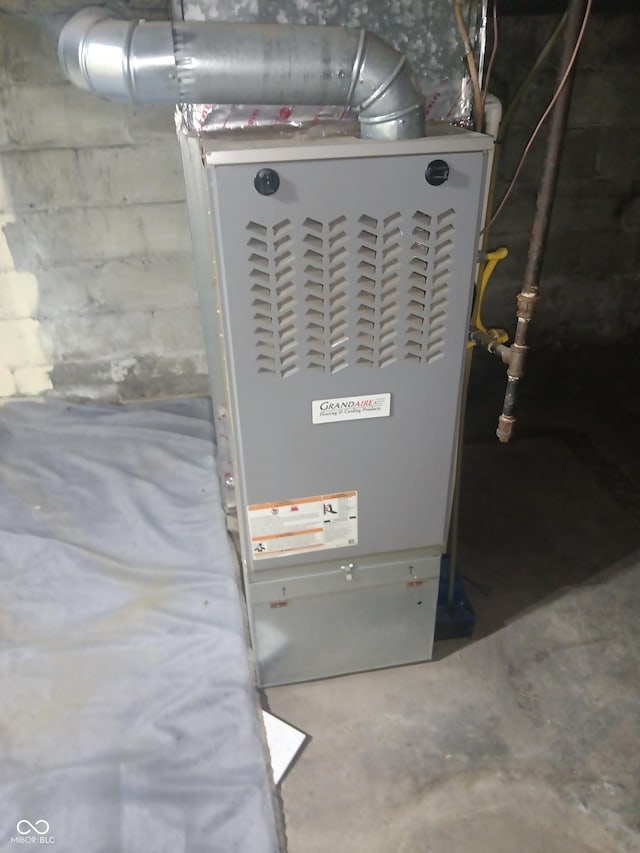 utility room with heating unit