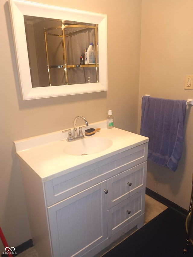 bathroom featuring vanity and a ceiling fan