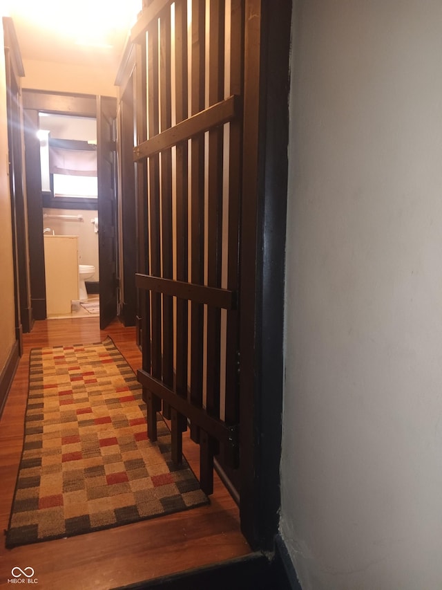 hallway with wood finished floors
