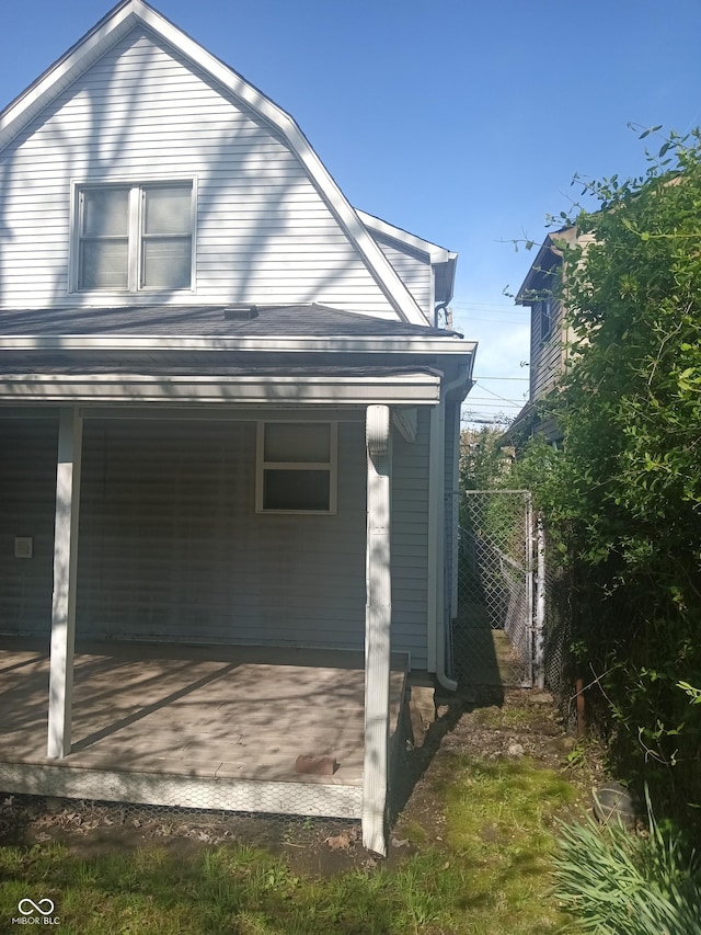 view of home's exterior featuring a patio area and fence