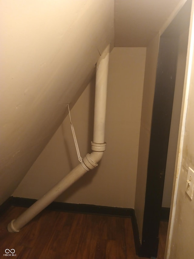 bonus room with vaulted ceiling and wood finished floors
