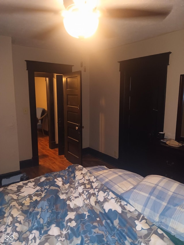 bedroom with ceiling fan and wood finished floors