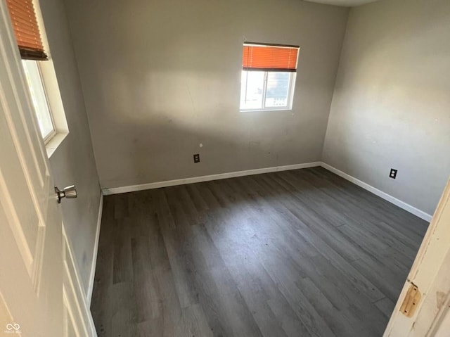 3031 E 38th St, Indianapolis, IN 46218 - unfurnished room featuring dark wood-style floors and baseboards