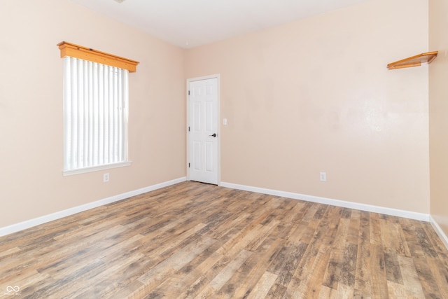 2761 Winding Creek Ln, Greenfield, IN 46140 - spare room featuring wood finished floors and healthy amount of natural light