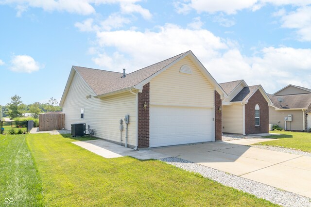 2761 Winding Creek Ln, Greenfield, IN 46140 - view of front of house with an attached garage, concrete driveway, and roof with shingles