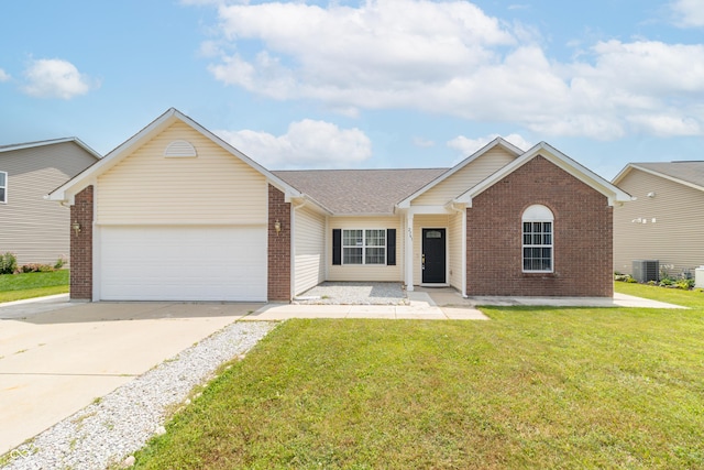 2761 Winding Creek Ln, Greenfield, IN 46140 - ranch-style house featuring brick siding, an attached garage, driveway, and a front lawn