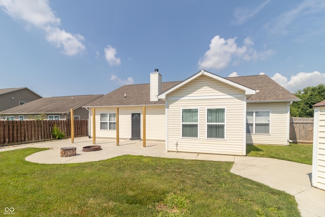 2761 Winding Creek Ln, Greenfield, IN 46140 - back of house featuring a patio, a chimney, and roof with shingles