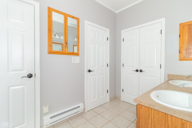 2761 Winding Creek Ln, Greenfield, IN 46140 - bathroom with a baseboard radiator, double vanity, and tile patterned floors