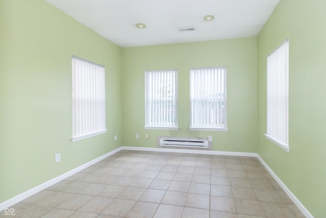 2761 Winding Creek Ln, Greenfield, IN 46140 - spare room with a baseboard radiator and light tile patterned flooring