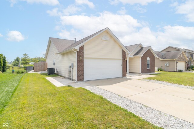 2761 Winding Creek Ln, Greenfield, IN 46140 - view of front of home with a garage, concrete driveway, and brick siding