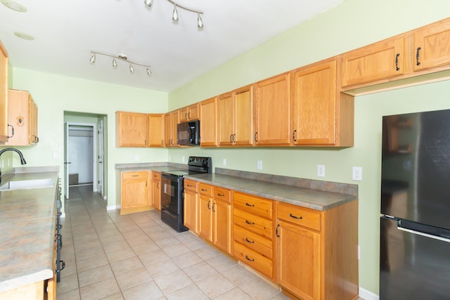 2761 Winding Creek Ln, Greenfield, IN 46140 - kitchen with black appliances and light tile patterned flooring