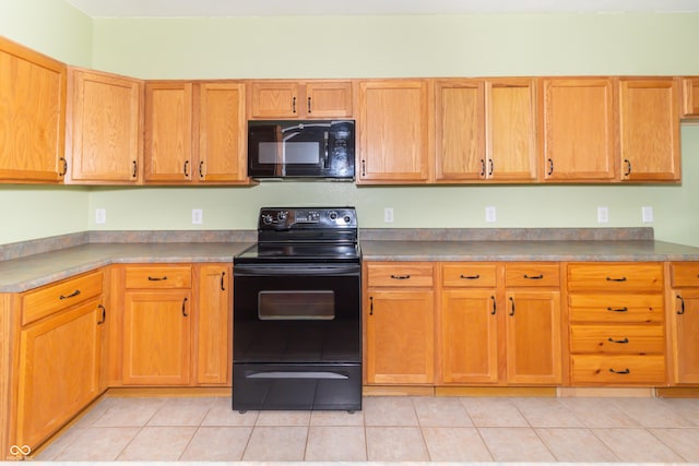 2761 Winding Creek Ln, Greenfield, IN 46140 - kitchen featuring black appliances and light tile patterned flooring