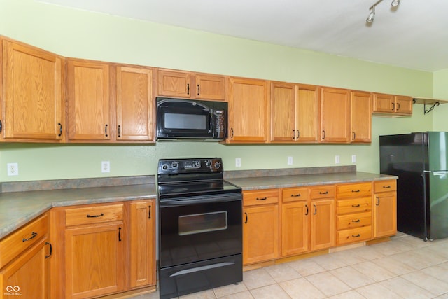 2761 Winding Creek Ln, Greenfield, IN 46140 - kitchen featuring black appliances and light tile patterned floors