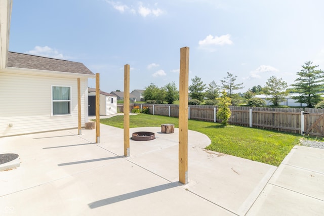 2761 Winding Creek Ln, Greenfield, IN 46140 - fenced backyard with a patio, a fire pit, and a storage shed
