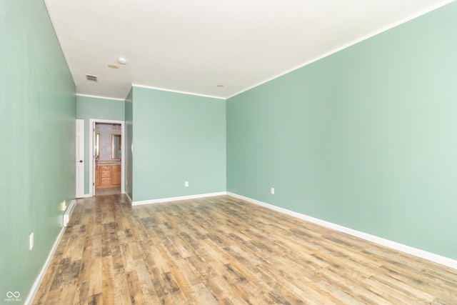 2761 Winding Creek Ln, Greenfield, IN 46140 - empty room with wood finished floors and crown molding