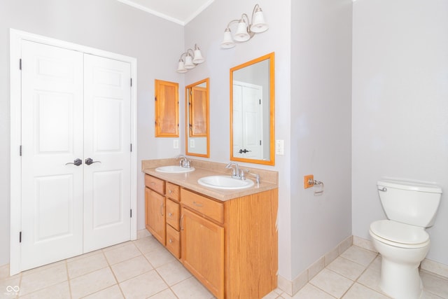 2761 Winding Creek Ln, Greenfield, IN 46140 - bathroom with double vanity, tile patterned floors, and ornamental molding