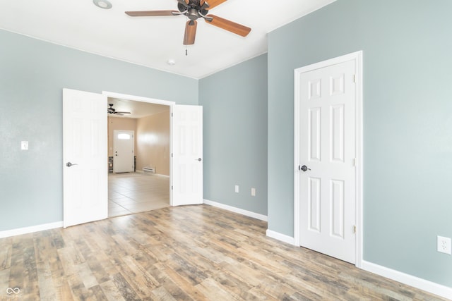 2761 Winding Creek Ln, Greenfield, IN 46140 - unfurnished bedroom with wood finished floors and ceiling fan