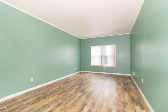2761 Winding Creek Ln, Greenfield, IN 46140 - spare room featuring wood finished floors and crown molding