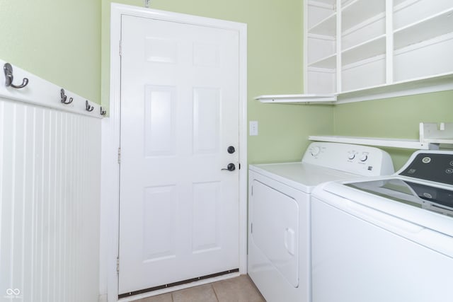 2761 Winding Creek Ln, Greenfield, IN 46140 - laundry room featuring washer and clothes dryer and light tile patterned floors