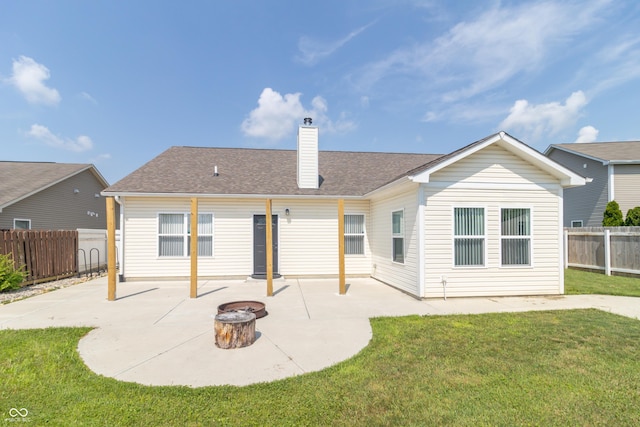 2761 Winding Creek Ln, Greenfield, IN 46140 - rear view of house featuring a patio area, an outdoor fire pit, and a chimney