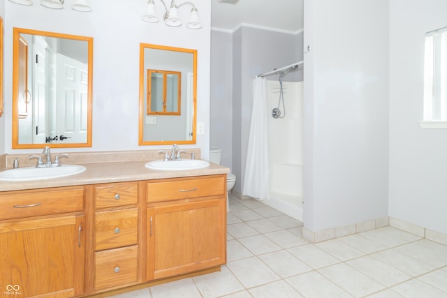2761 Winding Creek Ln, Greenfield, IN 46140 - bathroom with curtained shower, double vanity, crown molding, and tile patterned flooring