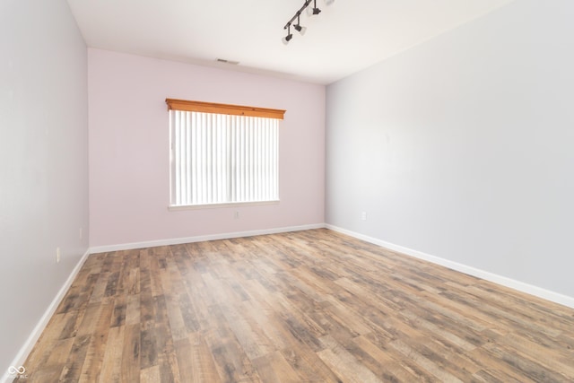 2761 Winding Creek Ln, Greenfield, IN 46140 - unfurnished room featuring wood finished floors and track lighting