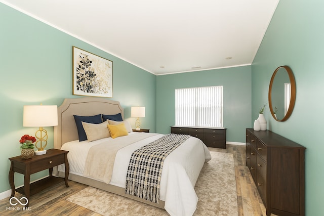 2761 Winding Creek Ln, Greenfield, IN 46140 - bedroom with wood finished floors and crown molding