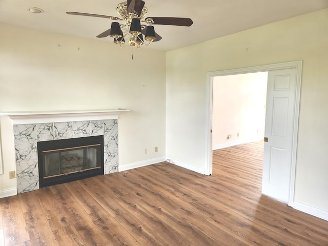 9909 E Mcgregor Rd, Indianapolis, IN 46259 - unfurnished living room with a fireplace, wood finished floors, ceiling fan, and baseboards