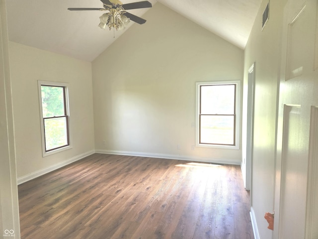 9909 E Mcgregor Rd, Indianapolis, IN 46259 - empty room featuring a ceiling fan, dark wood-style flooring, high vaulted ceiling, and baseboards