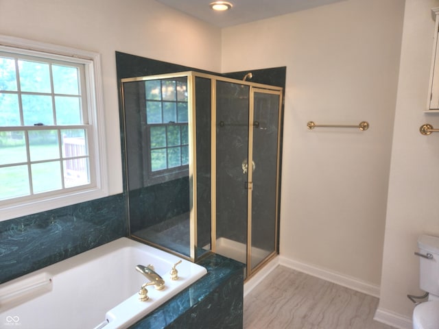 9909 E Mcgregor Rd, Indianapolis, IN 46259 - bathroom with healthy amount of natural light, a stall shower, toilet, and a bath