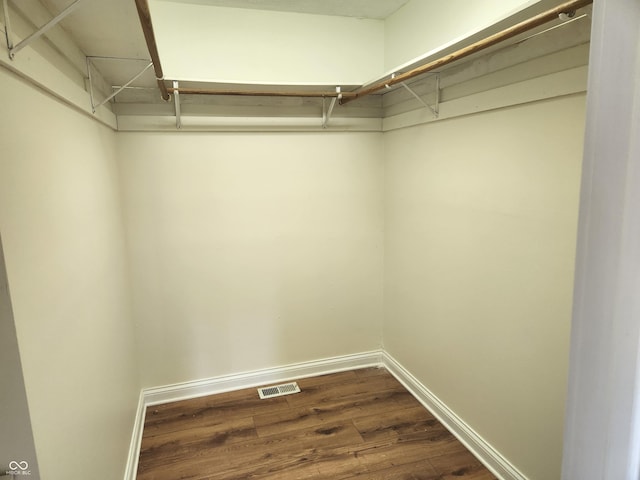 9909 E Mcgregor Rd, Indianapolis, IN 46259 - spacious closet with dark wood-type flooring