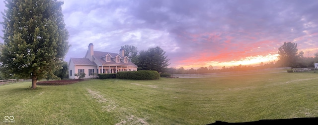 9909 E Mcgregor Rd, Indianapolis, IN 46259 - yard at dusk featuring a yard