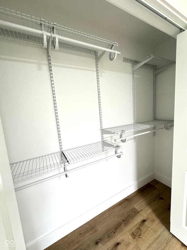 spacious closet with wood finished floors