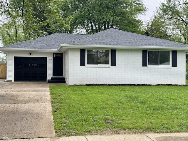 single story home with driveway, brick siding, a garage, roof with shingles, and a front lawn