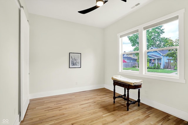 829 Olive St, Indianapolis, IN 46203 - spare room featuring ceiling fan, light wood-style floors, and baseboards