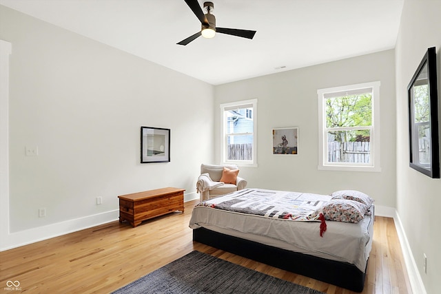 829 Olive St, Indianapolis, IN 46203 - bedroom featuring light wood-style flooring, baseboards, and ceiling fan