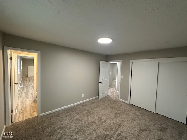 2453 Larnie Ln, Indianapolis, IN 46219 - unfurnished bedroom with carpet, a closet, and ensuite bathroom