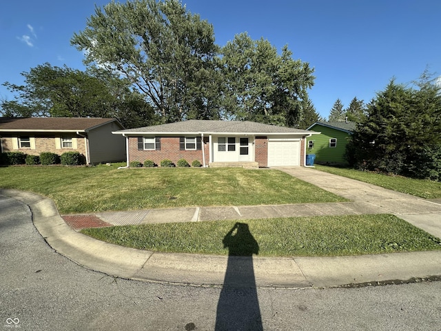 2453 Larnie Ln, Indianapolis, IN 46219 - single story home with driveway, a garage, brick siding, and a front yard