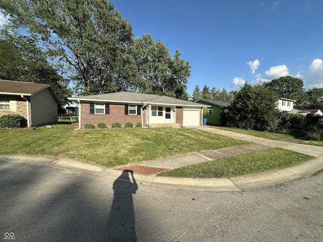 2453 Larnie Ln, Indianapolis, IN 46219 - single story home featuring driveway, a front yard, brick siding, and a garage