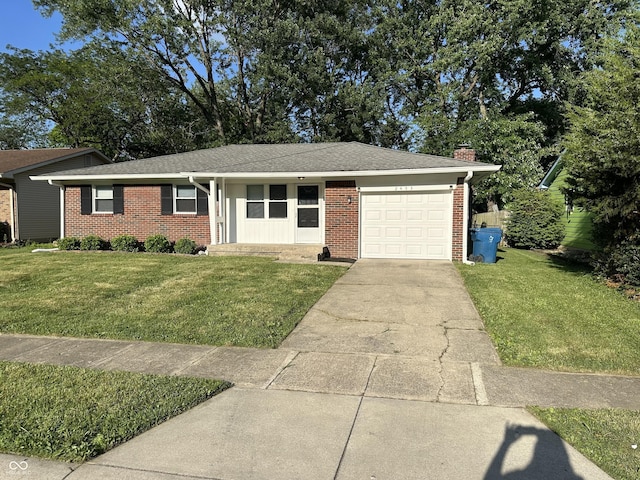 2453 Larnie Ln, Indianapolis, IN 46219 - single story home with brick siding, a garage, and a front yard