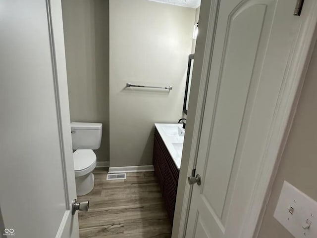 2453 Larnie Ln, Indianapolis, IN 46219 - half bath with vanity and wood finished floors
